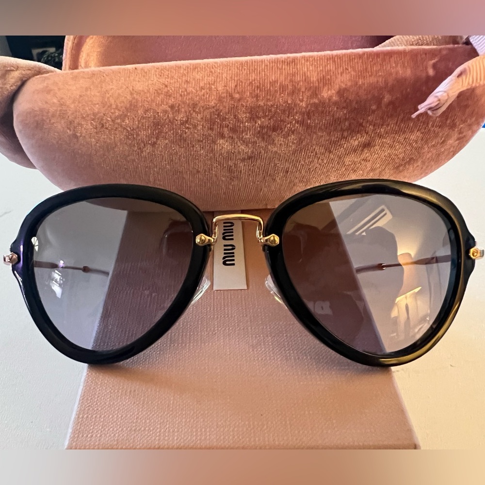 Miu Miu 03QS Aviator Sunglasses.